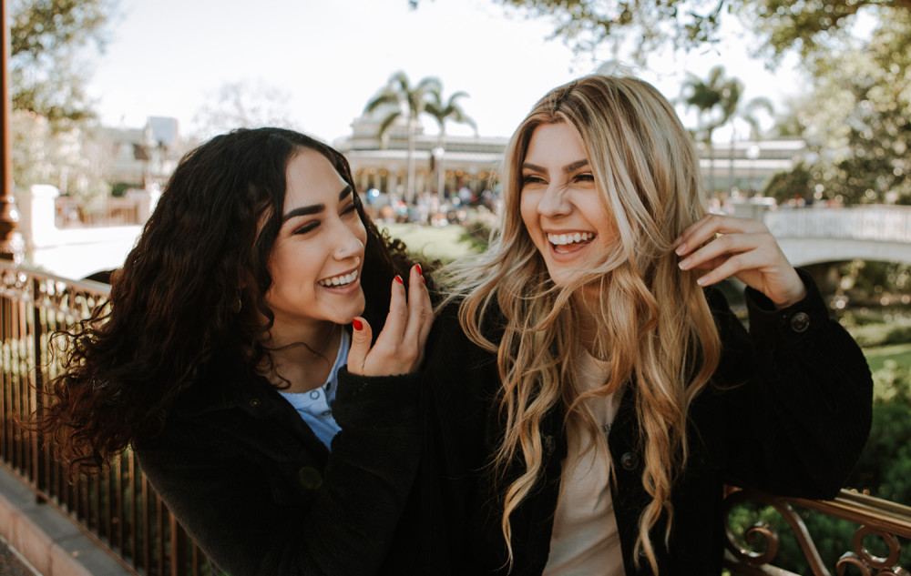 Two very happy smiling teenage girls